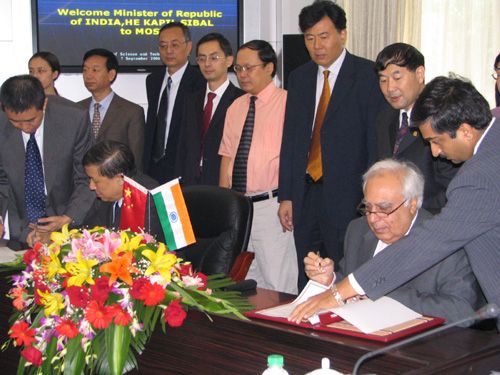 Mr. Kapil Sibal signing MoU in Beijing